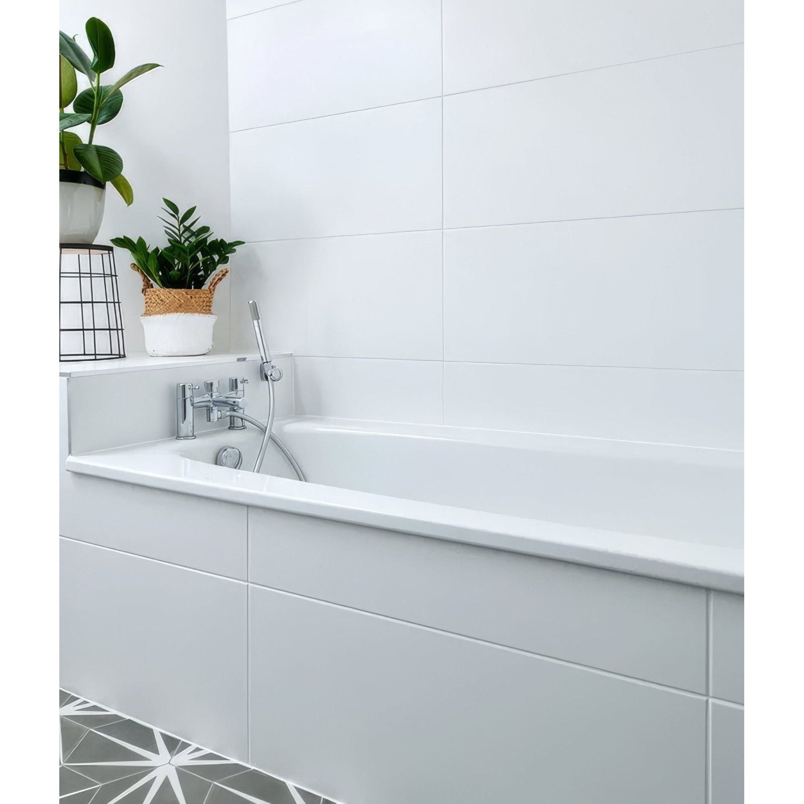 Delicate Wall Ceramic 33.3 x 55cm glossy white tiles with a bathtub and chrome fixtures