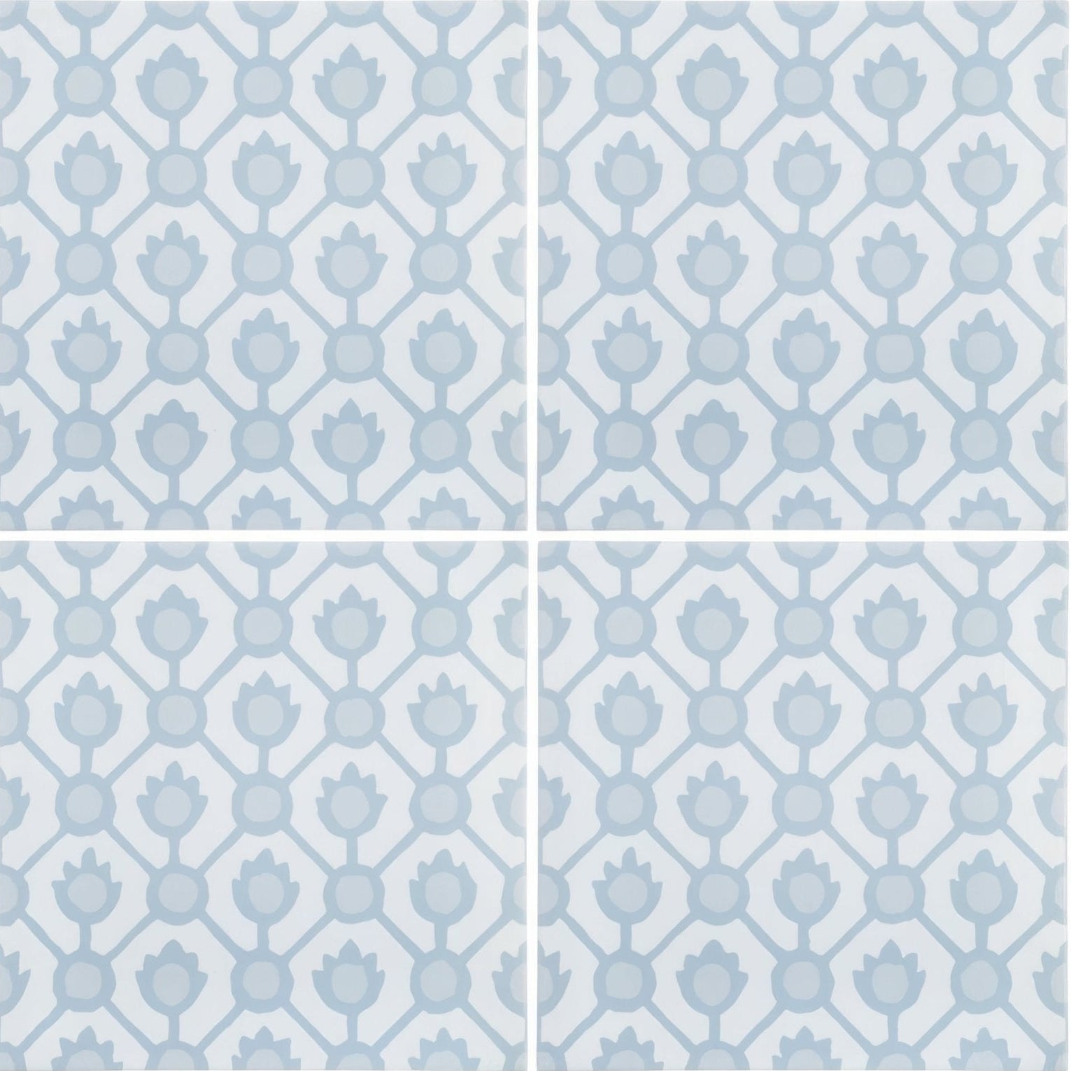 Light blue ceramic tiles with a repeating geometric pattern of stylized lotus flowers and circles by designers guild jaal sky blue