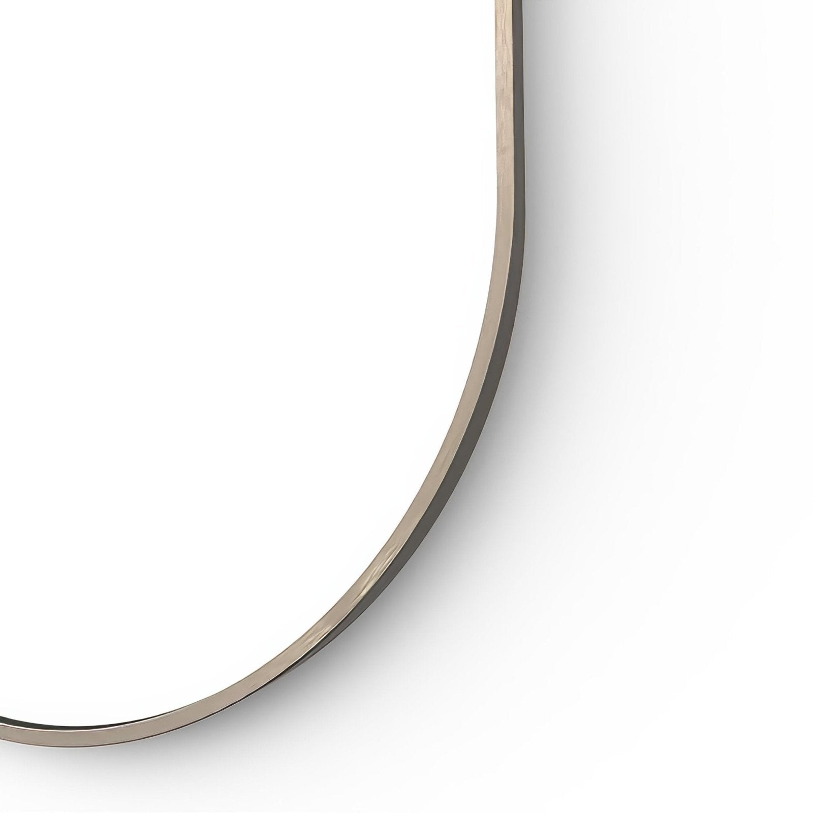 Docklands capsule mirror with a sleek curved brushed bronze frame featuring subtle wood grain detailing along the edge