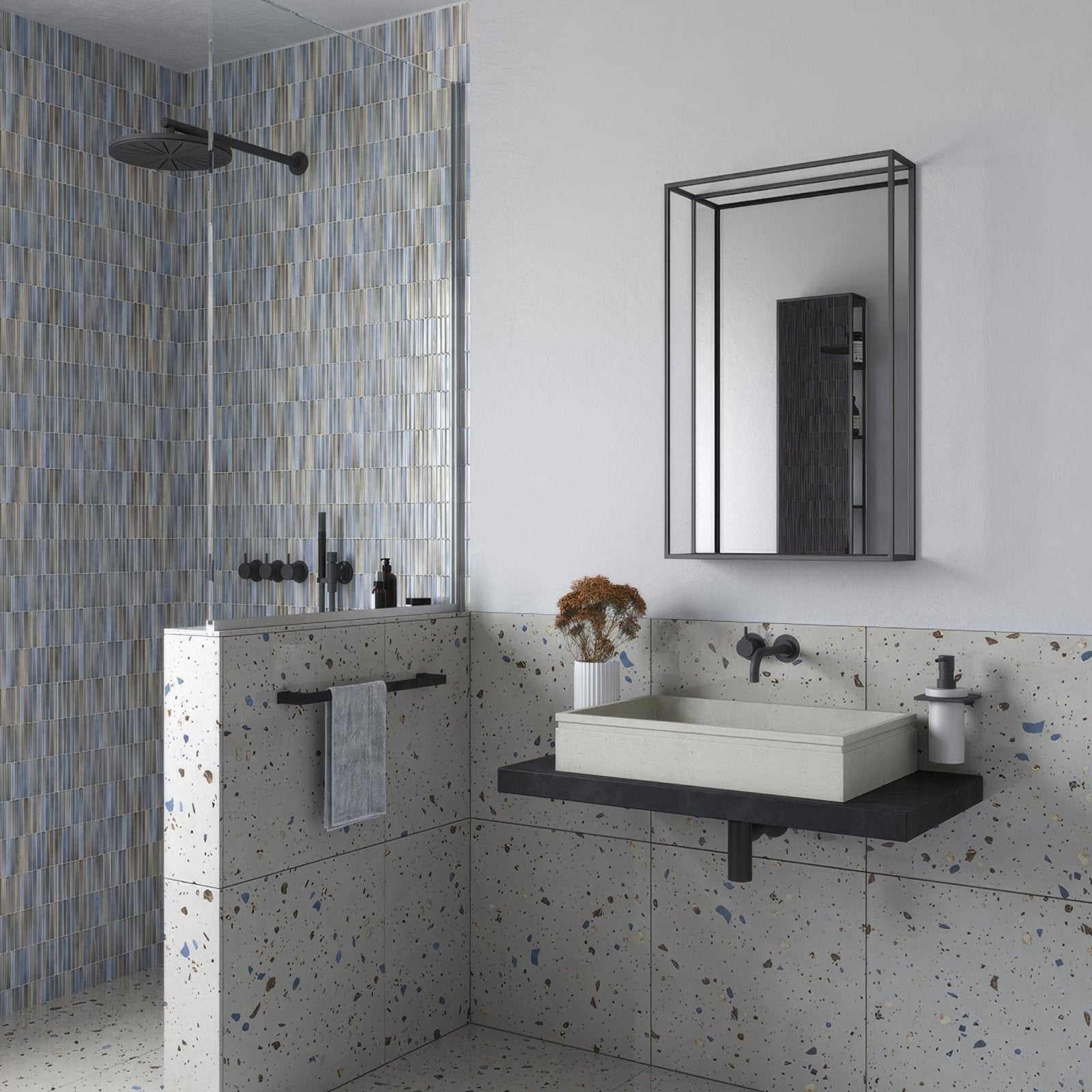 Modern white rectangular sink with black countertop and faucet against speckled gray terrazzo walls with docklands mirror with shelf 50x80cm in black