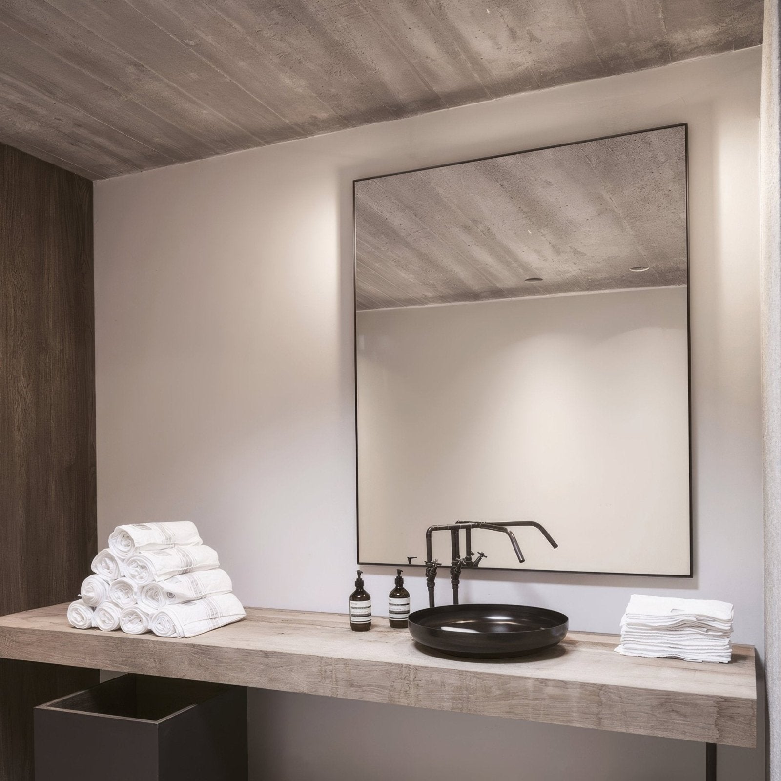 Docklands Rectangular Mirror 120x70cm Black black-framed rectangular mirror above a black vessel sink
