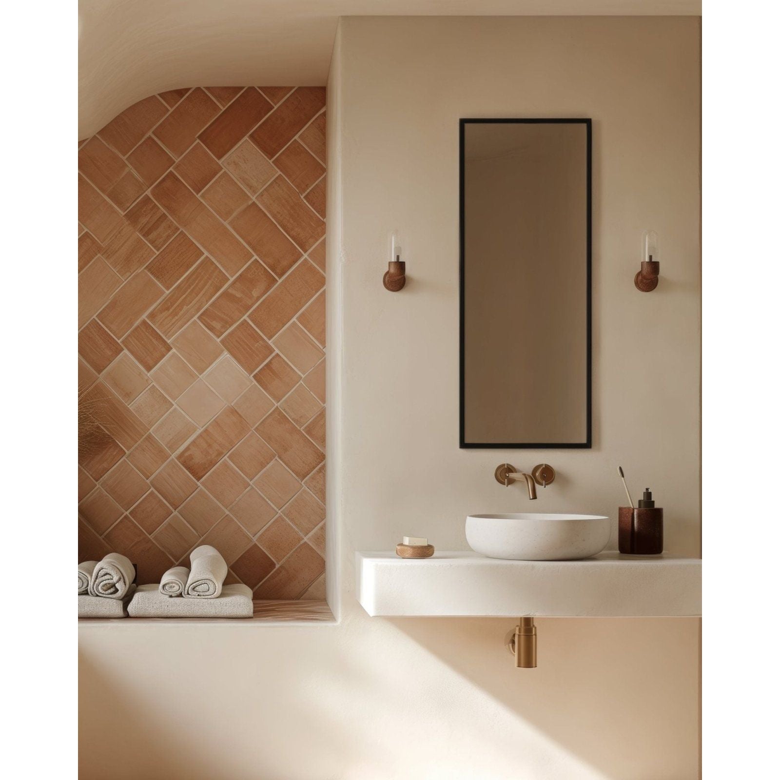 White ceramic vessel sink with brushed brass faucet on white countertop under docklands rectangular mirror 40x100cm black