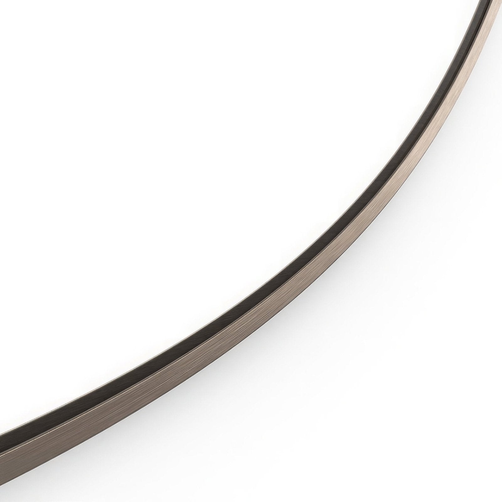 A docklands round mirror with a sleek curved frame in brushed bronze finish and darkened edge detailing