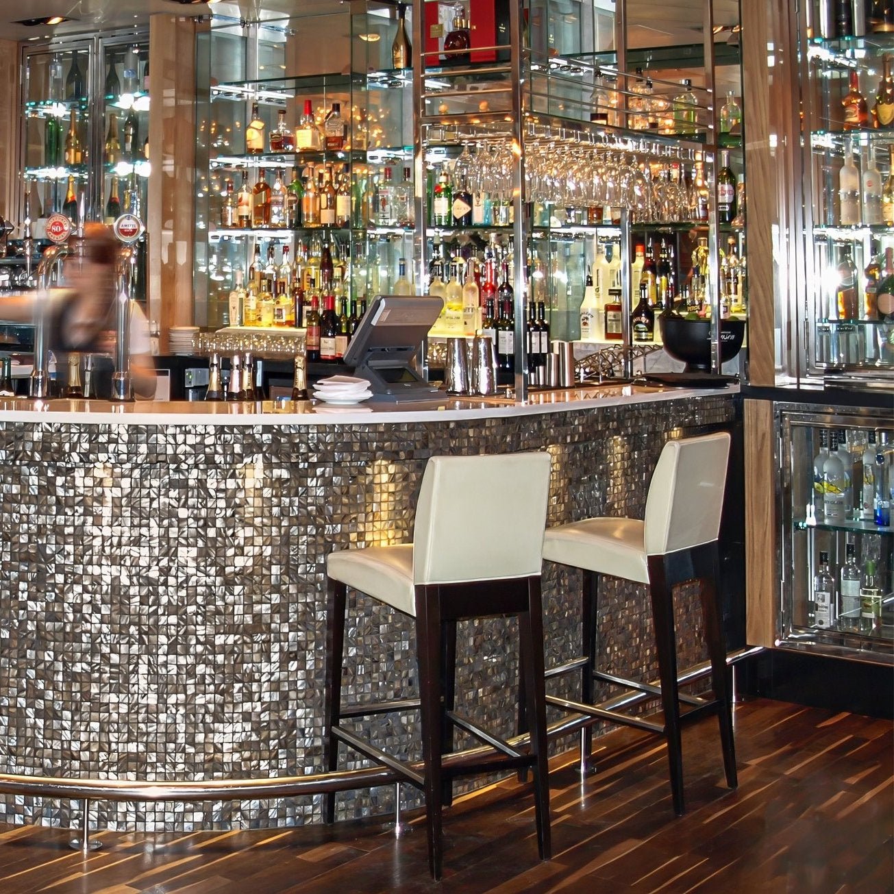 Dove grey 25mm square shiny silver mosaic tiled bar counter with dark wood legs and sleek modern design