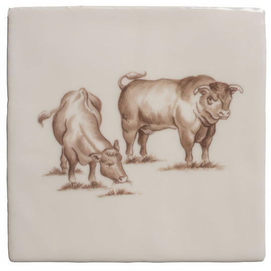 Cream-colored ceramic tile with a detailed sepia illustration of two brown cattle on cotton fabric background