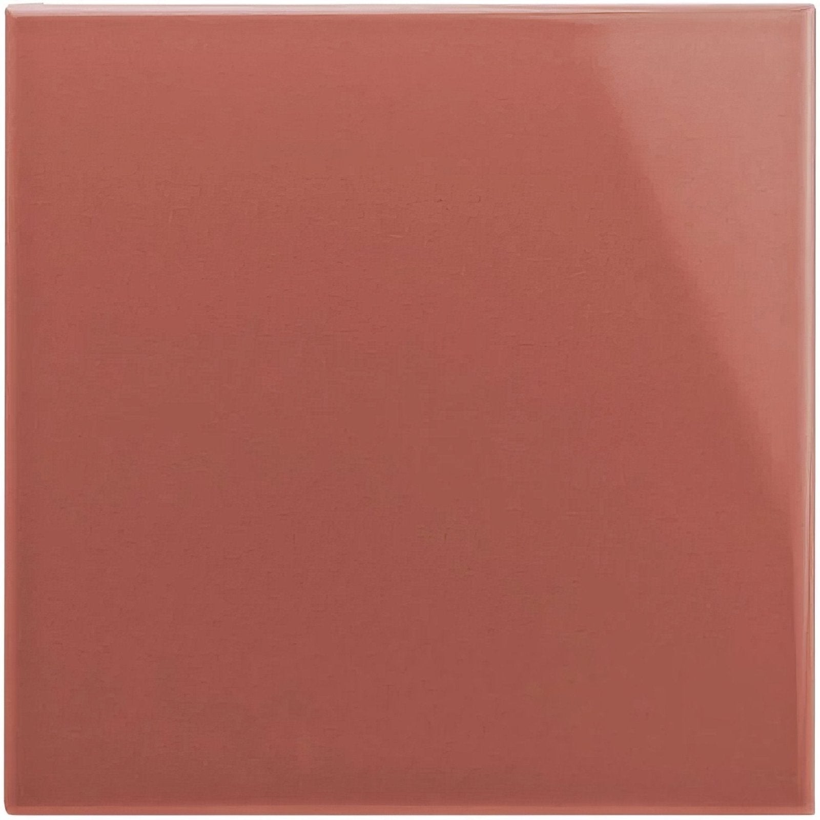 A square glossy terracotta ceramic tile with a smooth reflective surface duchy pink field tile