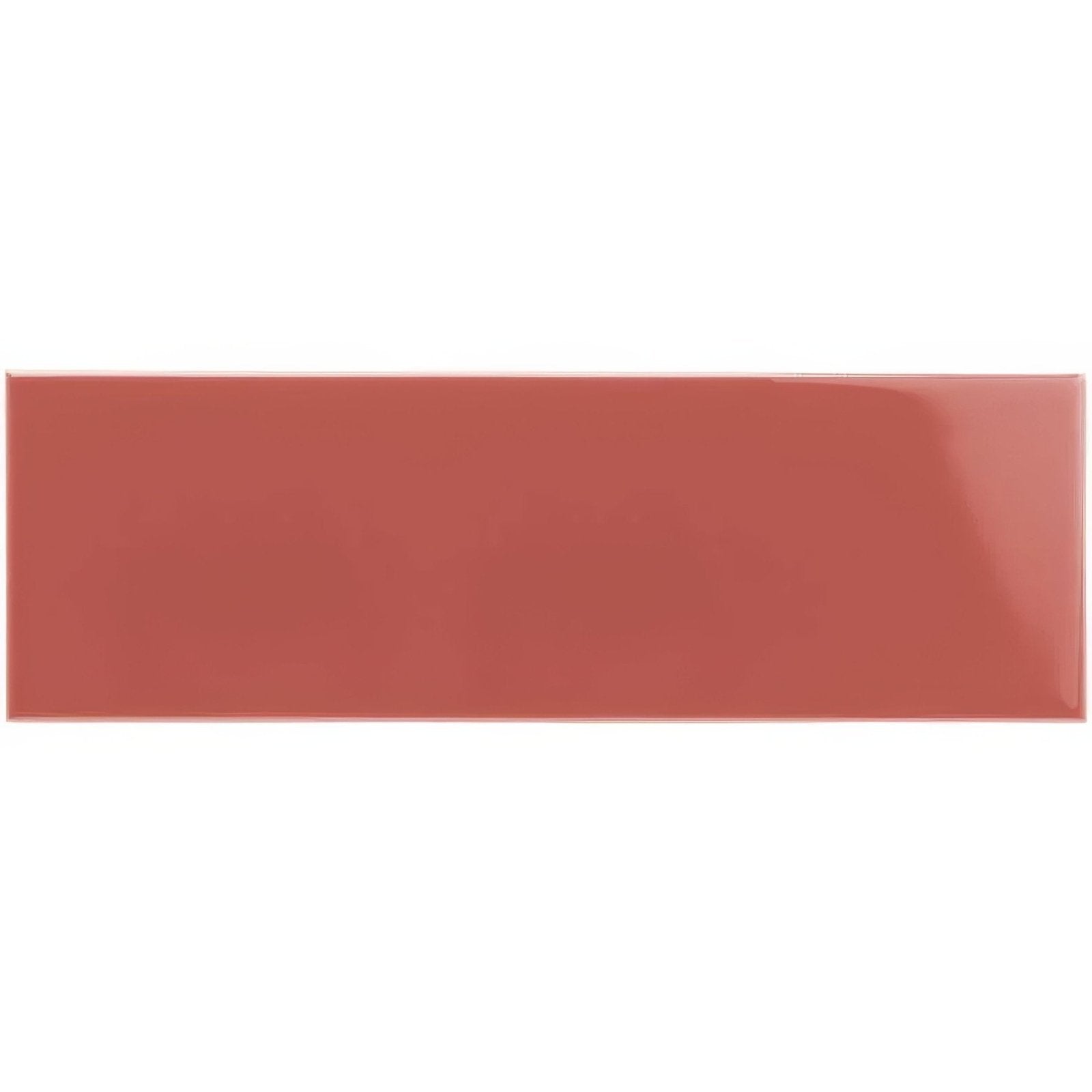 A glossy terracotta rectangular duchy pink large brick tile with a smooth uniform surface for wall or floor use