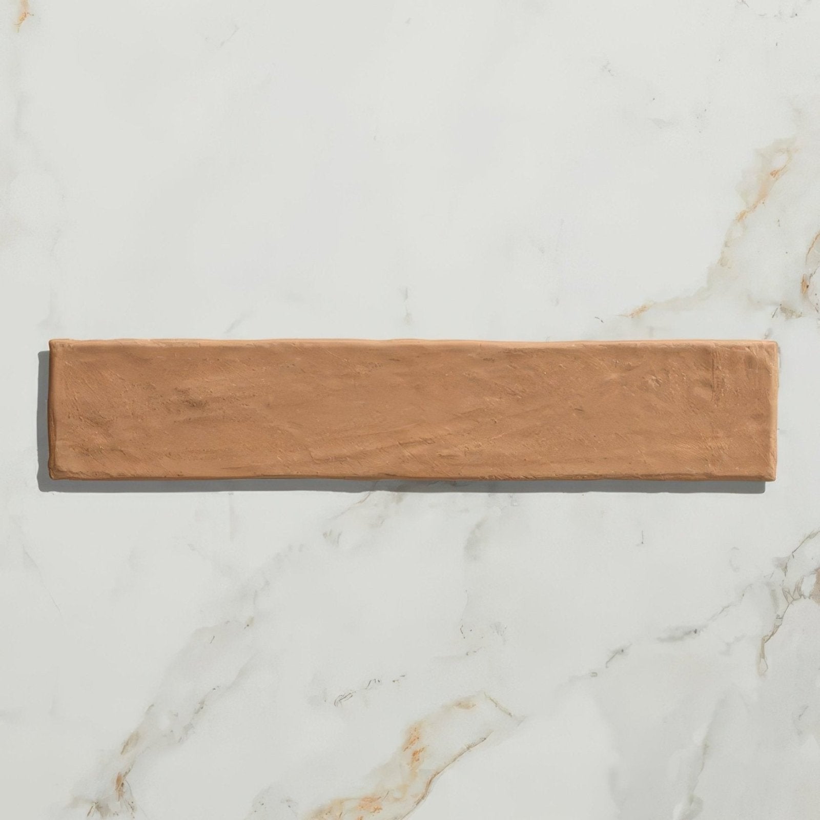 Earthenware porcelain coral rectangular tile with a terracotta color and textured rustic finish