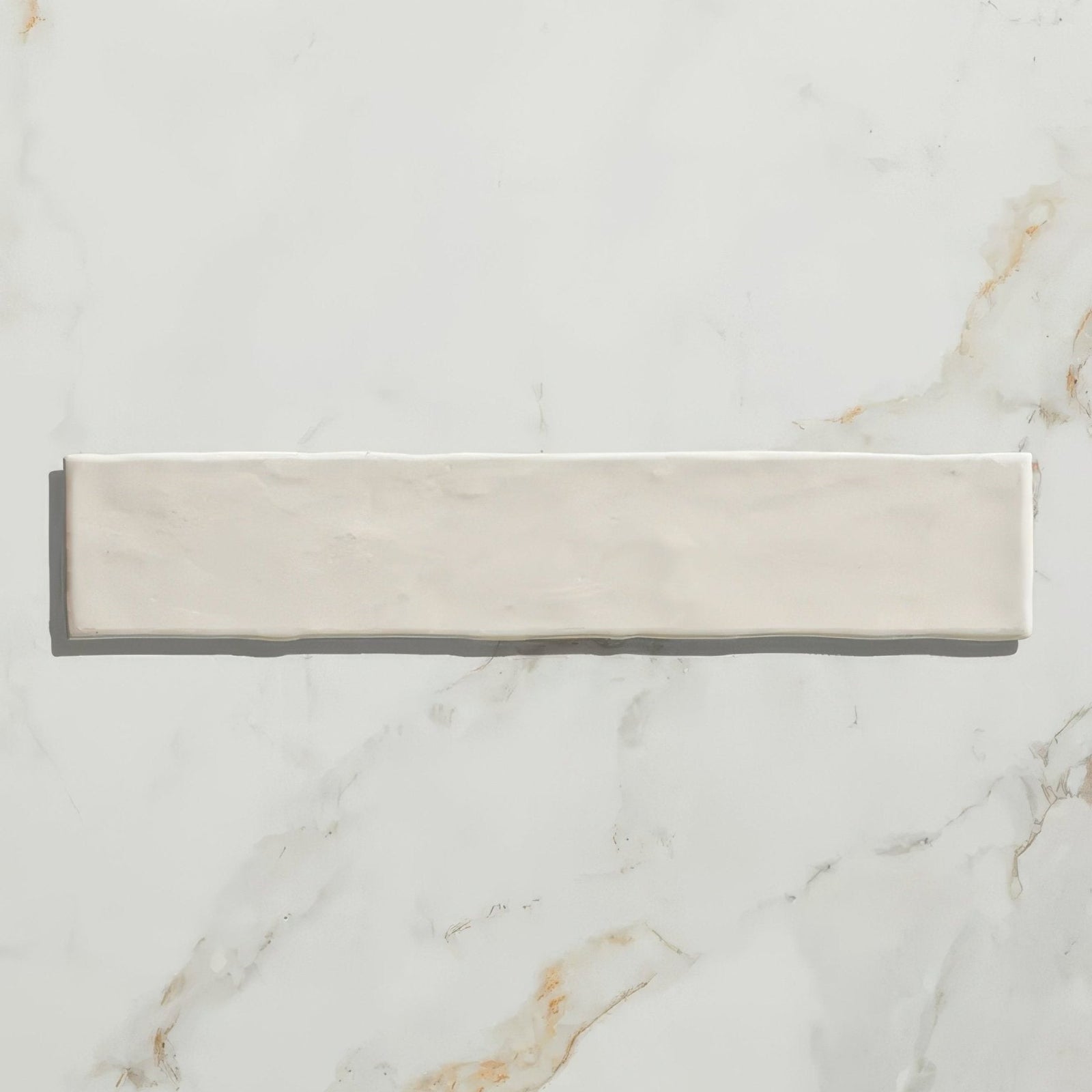 Cream-colored rectangular earthenware porcelain tile with a subtle matte finish and soft natural texture