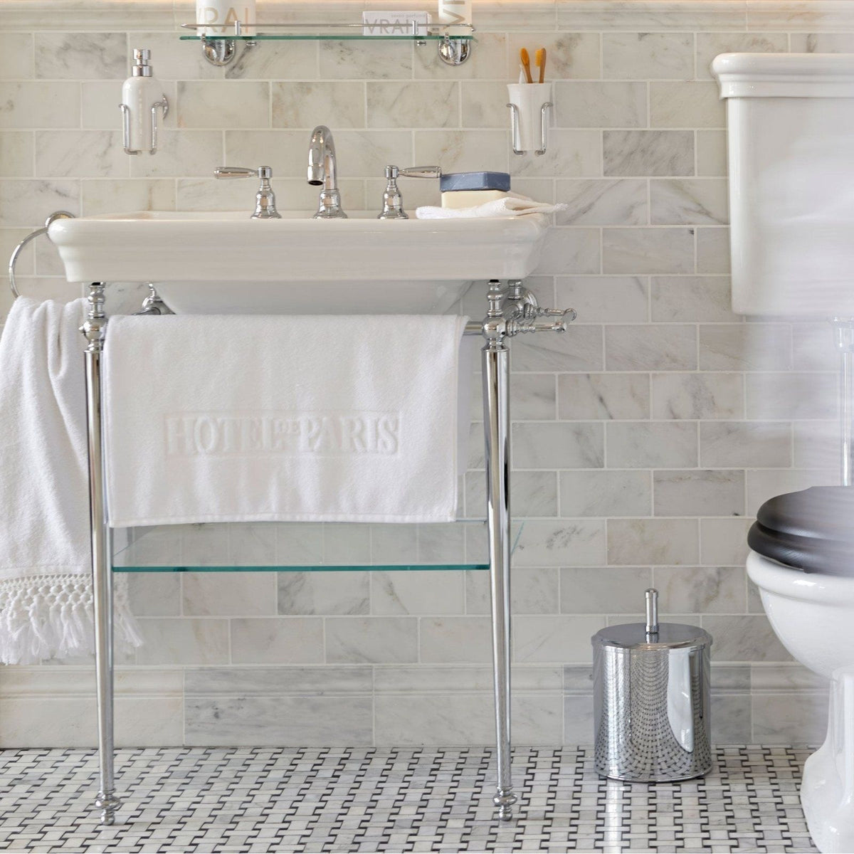 East Hampton Basketweave Marble Mosaic white and black marble basketweave mosaic with a white towel over a sink's chrome legs