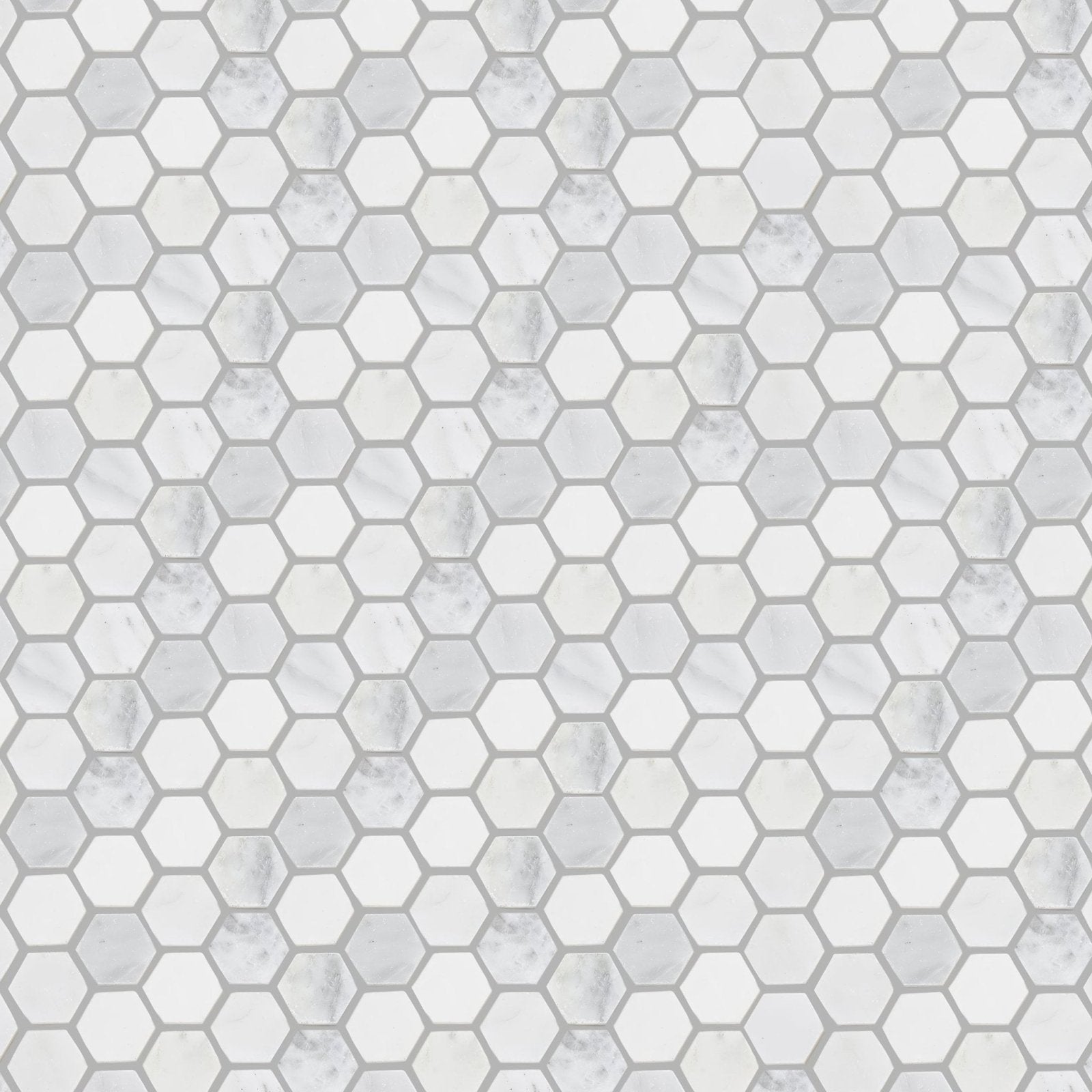 White marble hexagon mosaic tile with subtle gray veining from east hampton hexagon marble mosaic collection