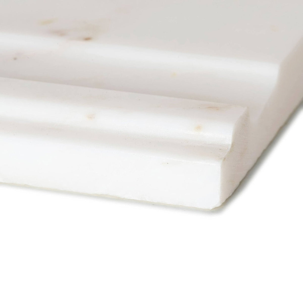 White marble baseboard with subtle veining and polished finish for east hampton marble deco skirting installation