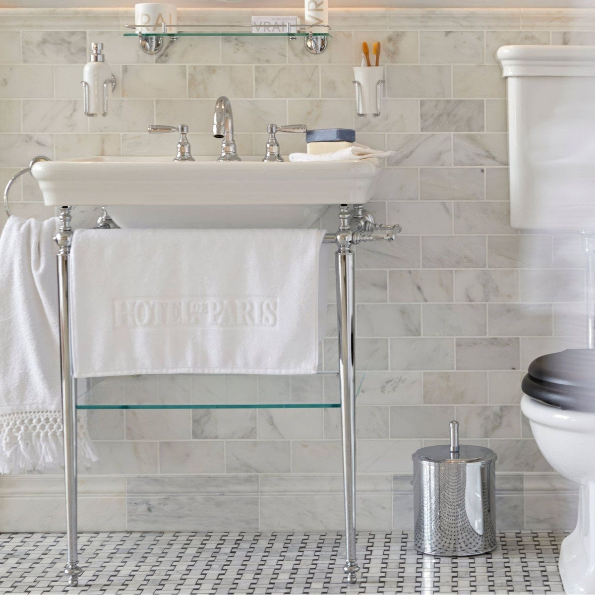 East Hampton Marble Skirting white marble skirting with an embroidered towel