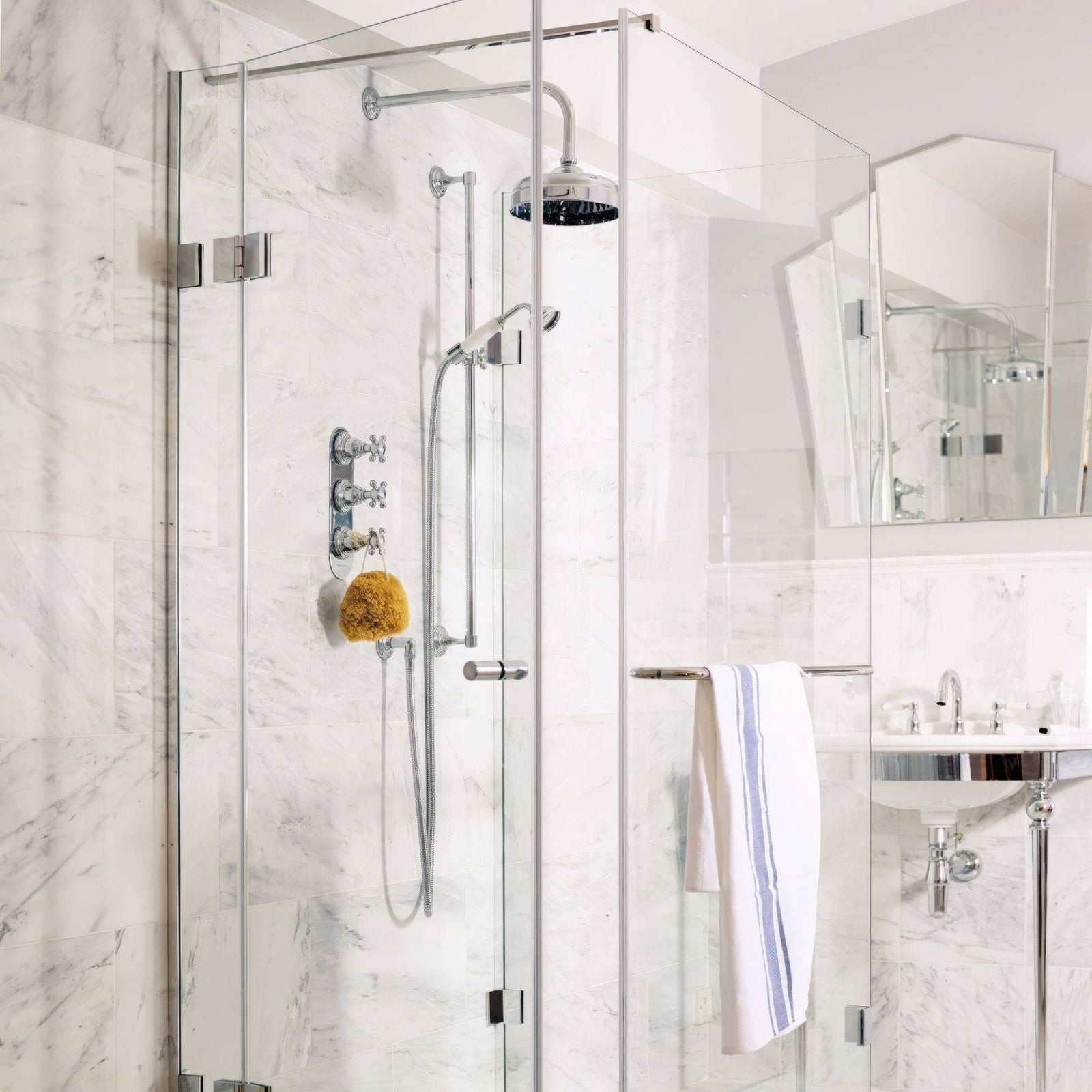 Modern chrome finished showerhead with sleek circular design and blackened center for east hampton marble tile 30x30cm