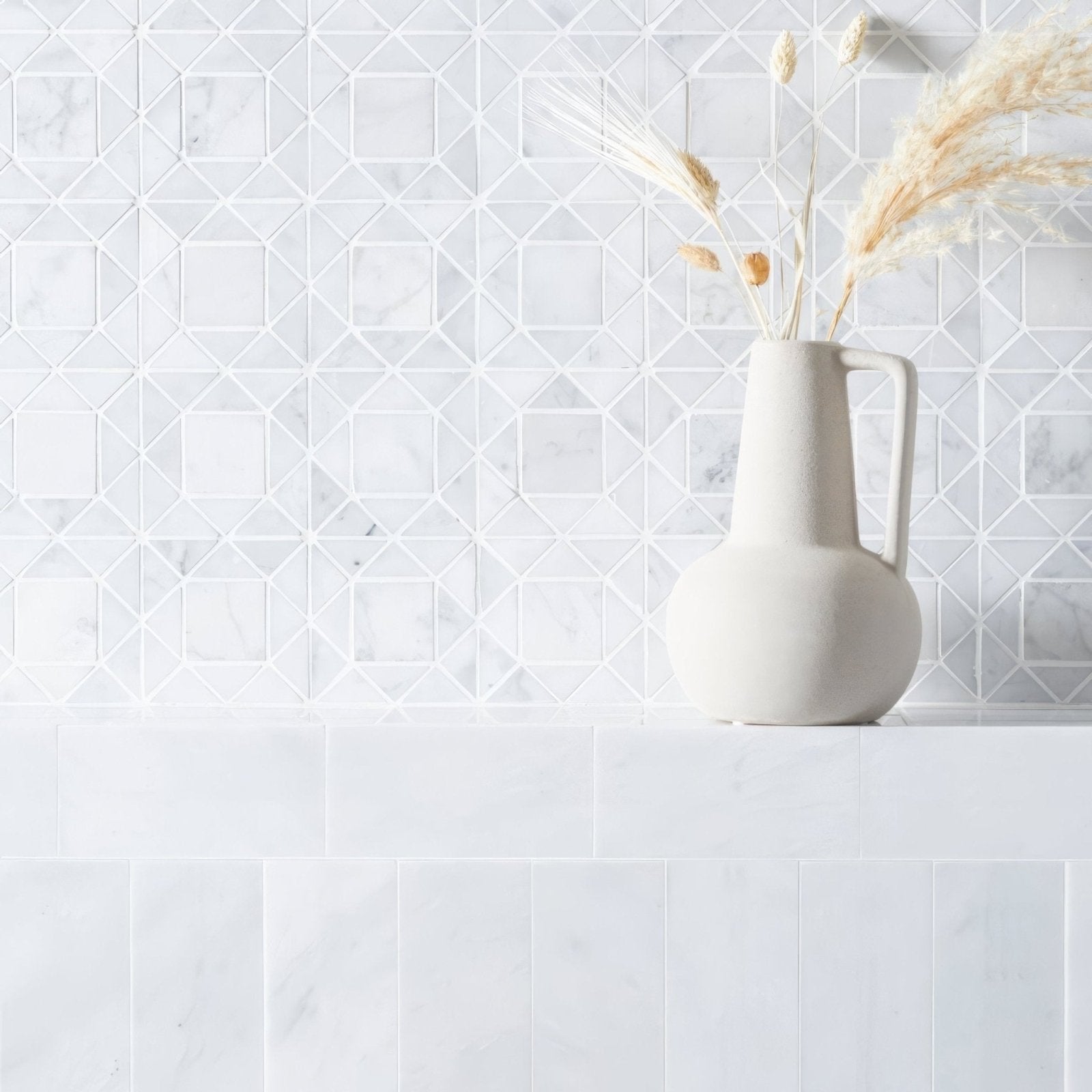 East Hampton Marble Tile 7.5x15cm white marble tiles with a pitcher of pampas grass
