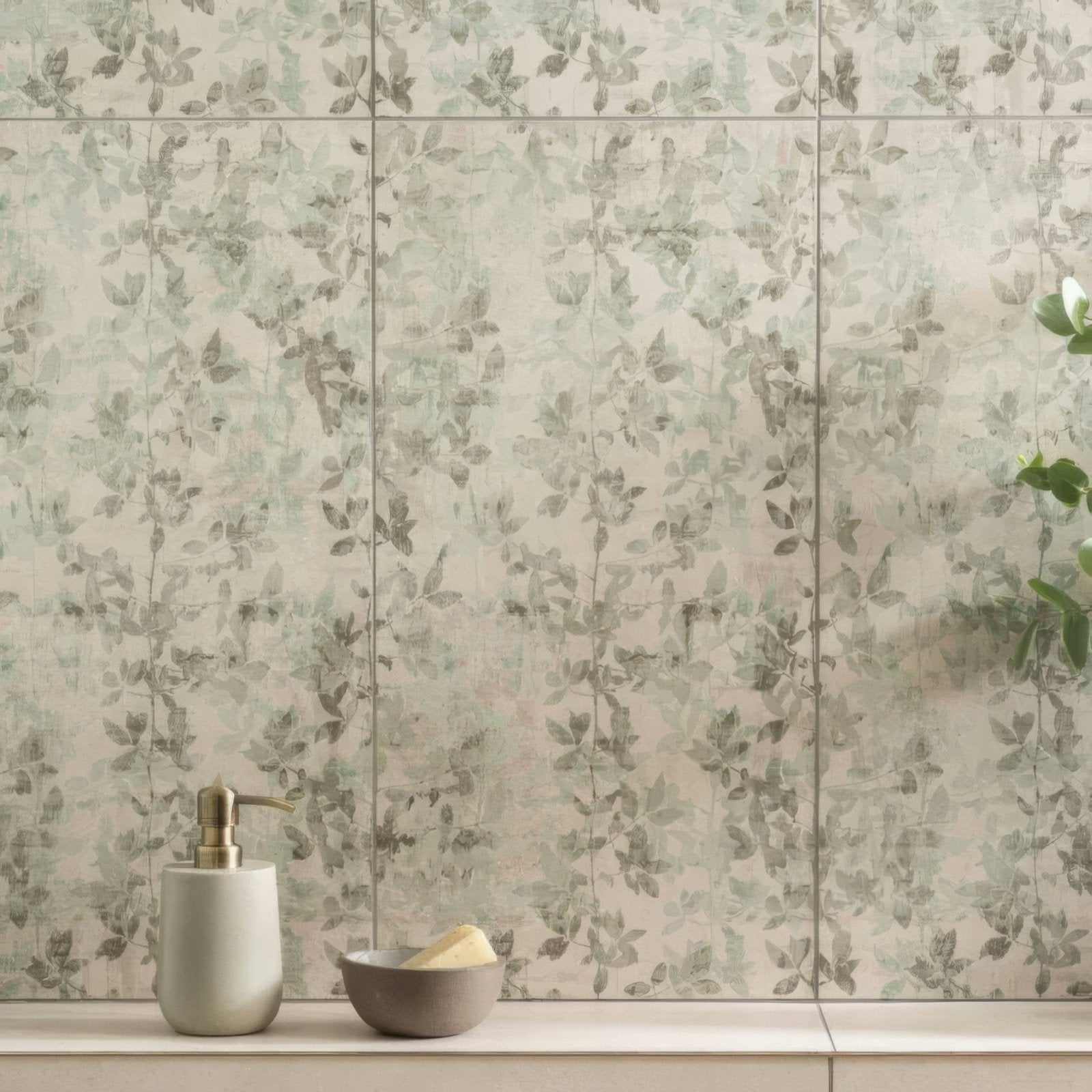 A matte white ceramic soap dispenser with a gold-toned pump featured in the eden pergola 60x30cm collection