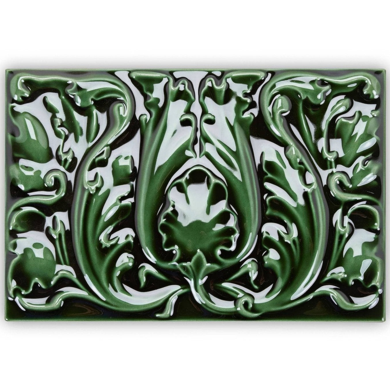 A glossy emerald green ceramic tile with raised relief art nouveau floral and leaf motifs edwardian acanthus caledonian