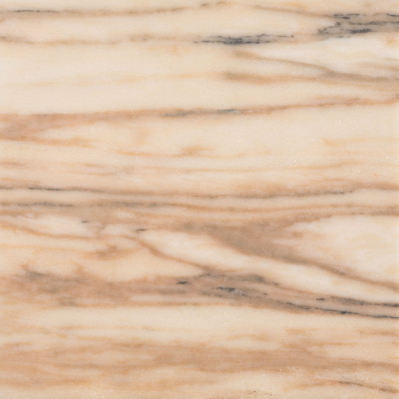 Elixir marble oud rose honed cream-colored marble with flowing golden-brown and dark gray veining surface
