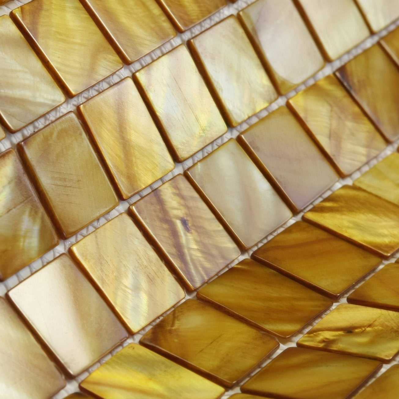 Golden rectangular mother of pearl mosaic tiles emerald gold 25mm square with a lustrous iridescent finish