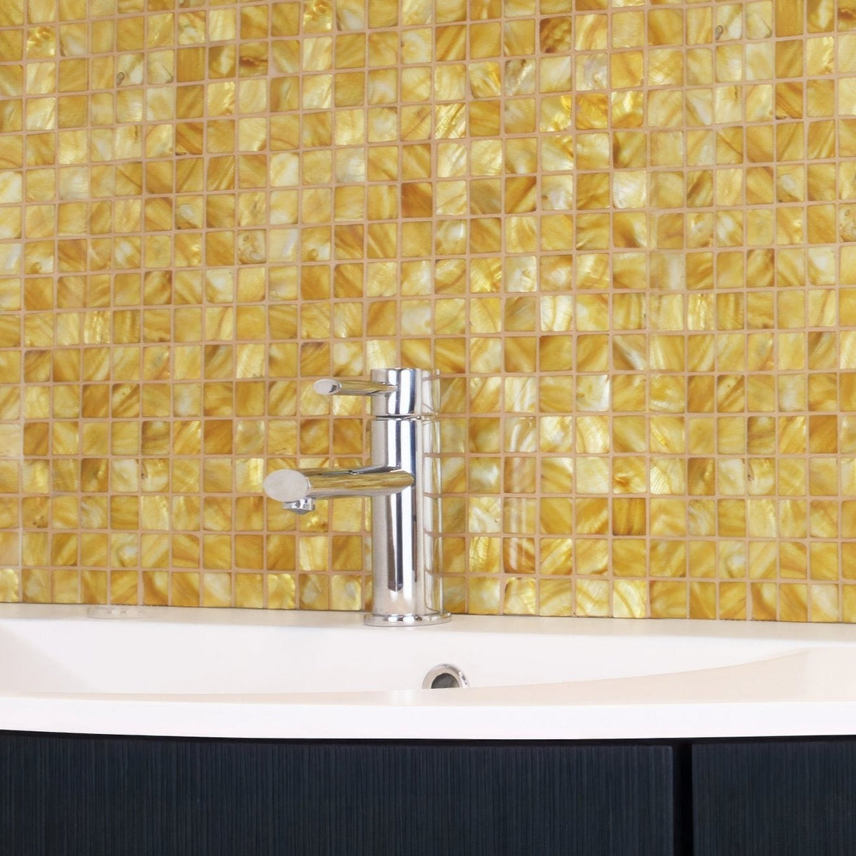 Emerald Gold 25mm Square gold mosaic behind a chrome bathroom tap
