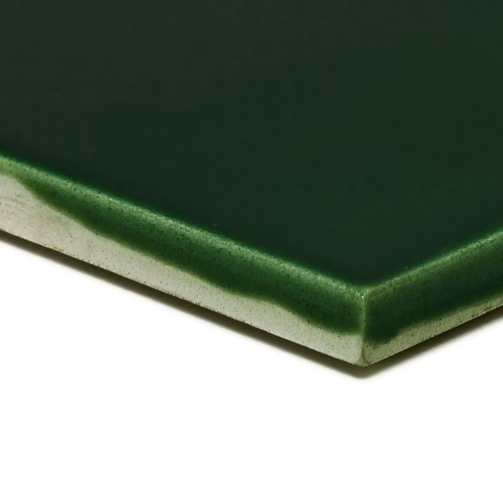 Dark green glossy ceramic tile empress malachite base with speckled texture along the edge