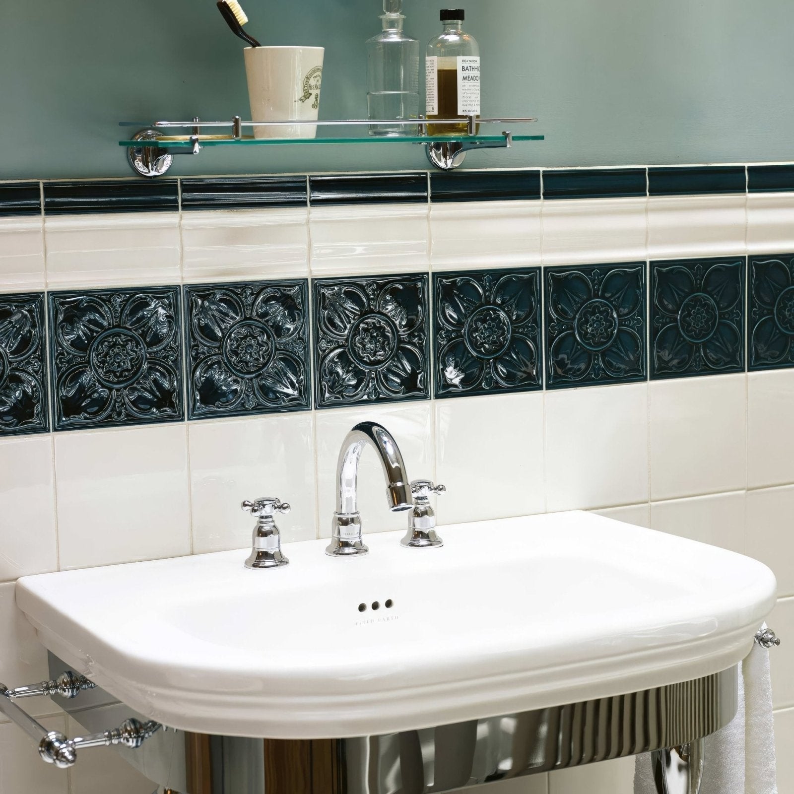White ceramic pedestal sink empress pearl base with polished chrome faucet and handles for bathroom use