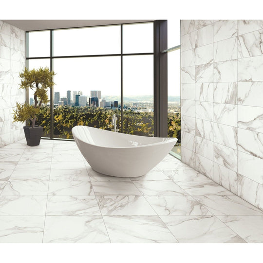 Energy Stone Calacatta 60 x 60cm white marble-effect tiles with a freestanding bathtub