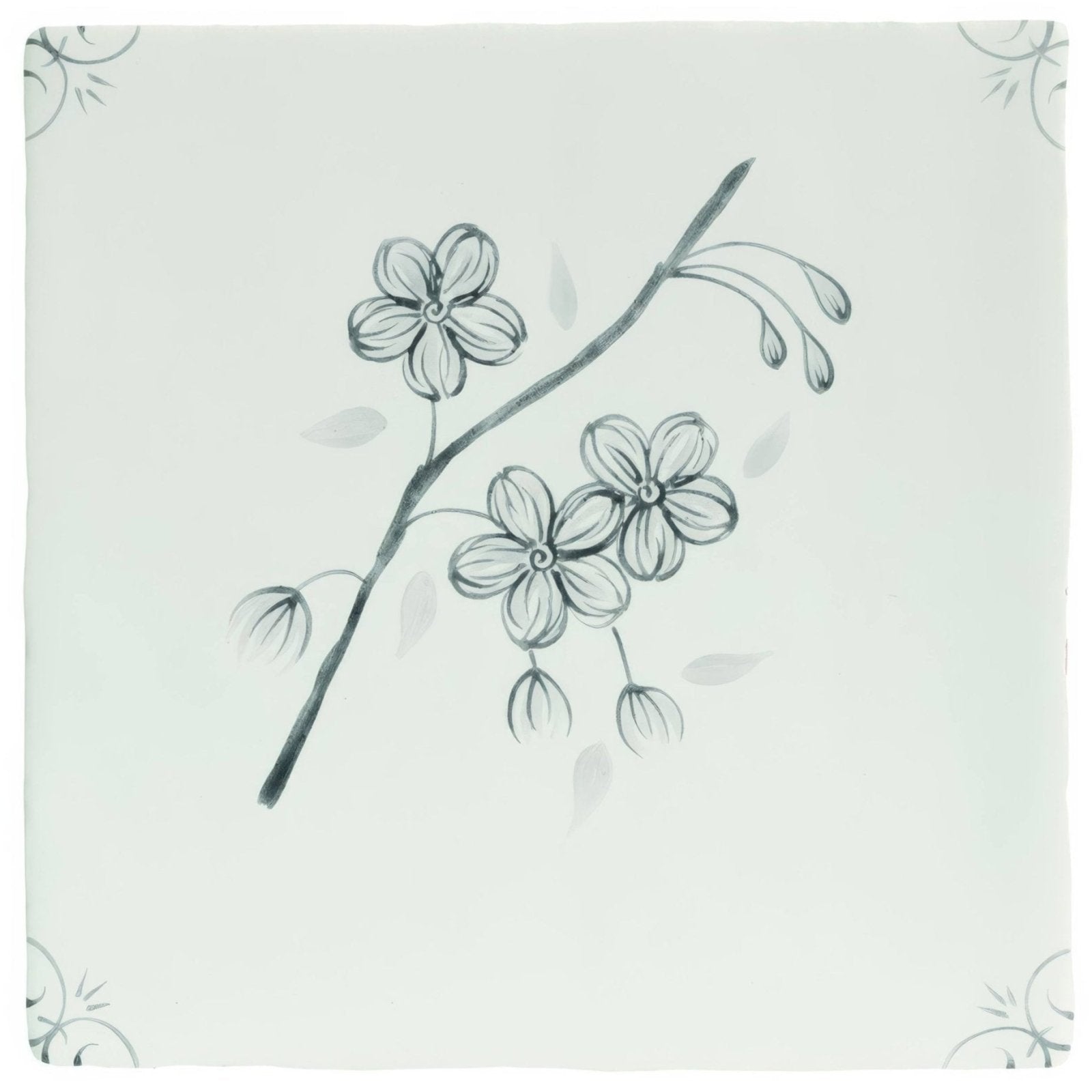 A delicate black ink sketch of a flowering branch on a pale green ceramic tile english delft charcoal blossom