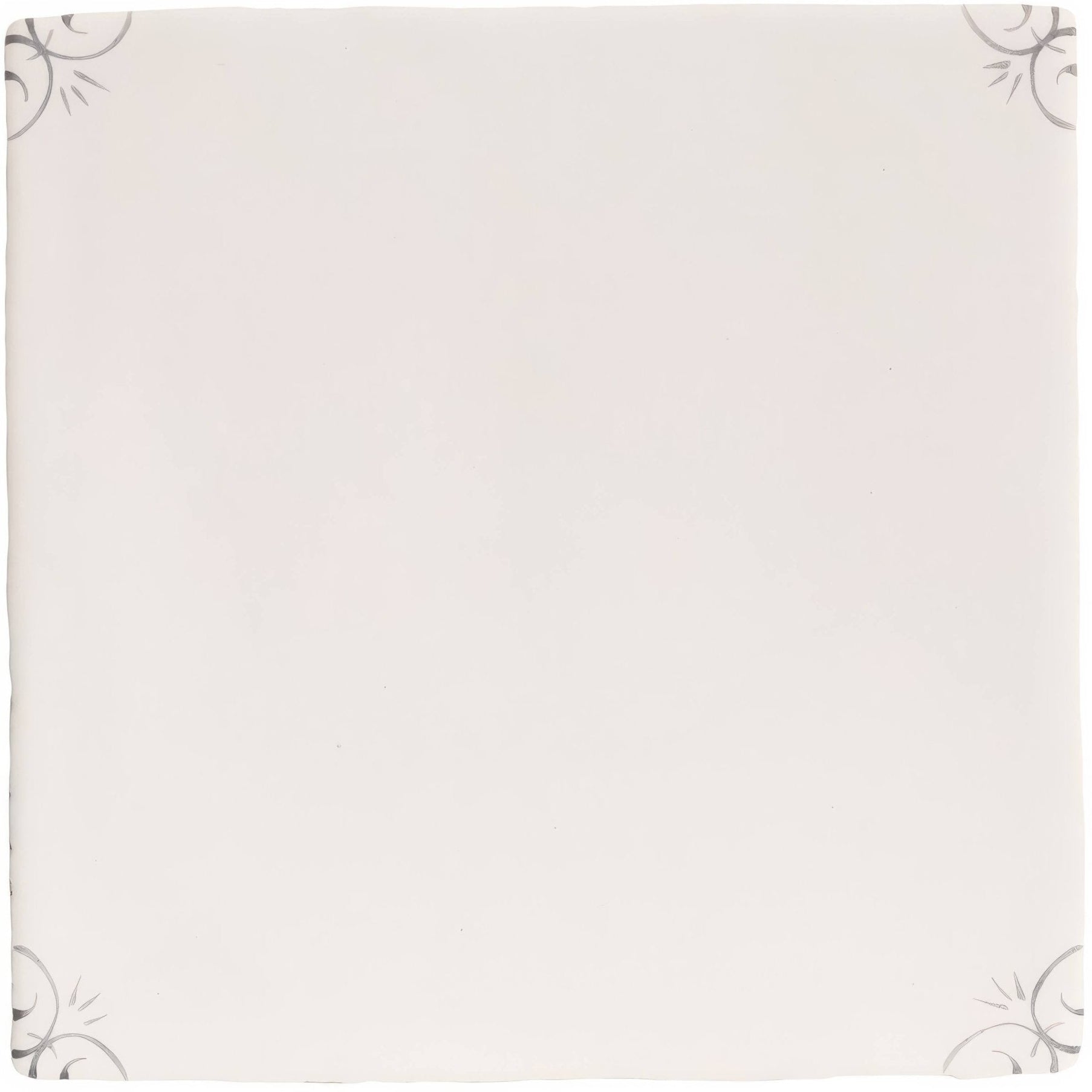 Off-white ceramic English Delft charcoal corners plate with subtle gray floral patterns in each corner