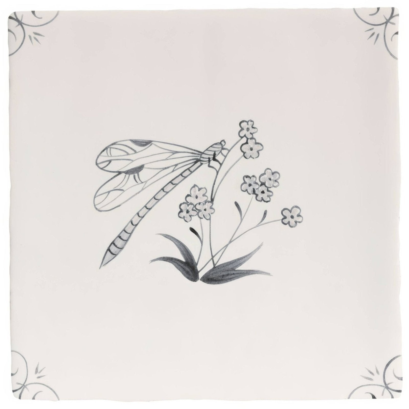 A delicate off-white ceramic tile featuring a detailed black ink charcoal dragonfly illustration by English Delft