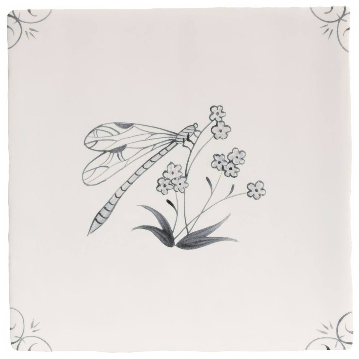 A delicate off-white ceramic tile featuring a detailed black ink charcoal dragonfly illustration by English Delft