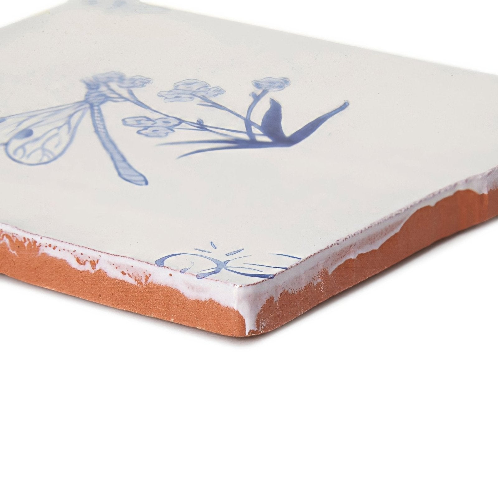 English delft dragonfly blue gloss tile is a square ceramic tile with white glaze and blue hand-painted dragonfly design
