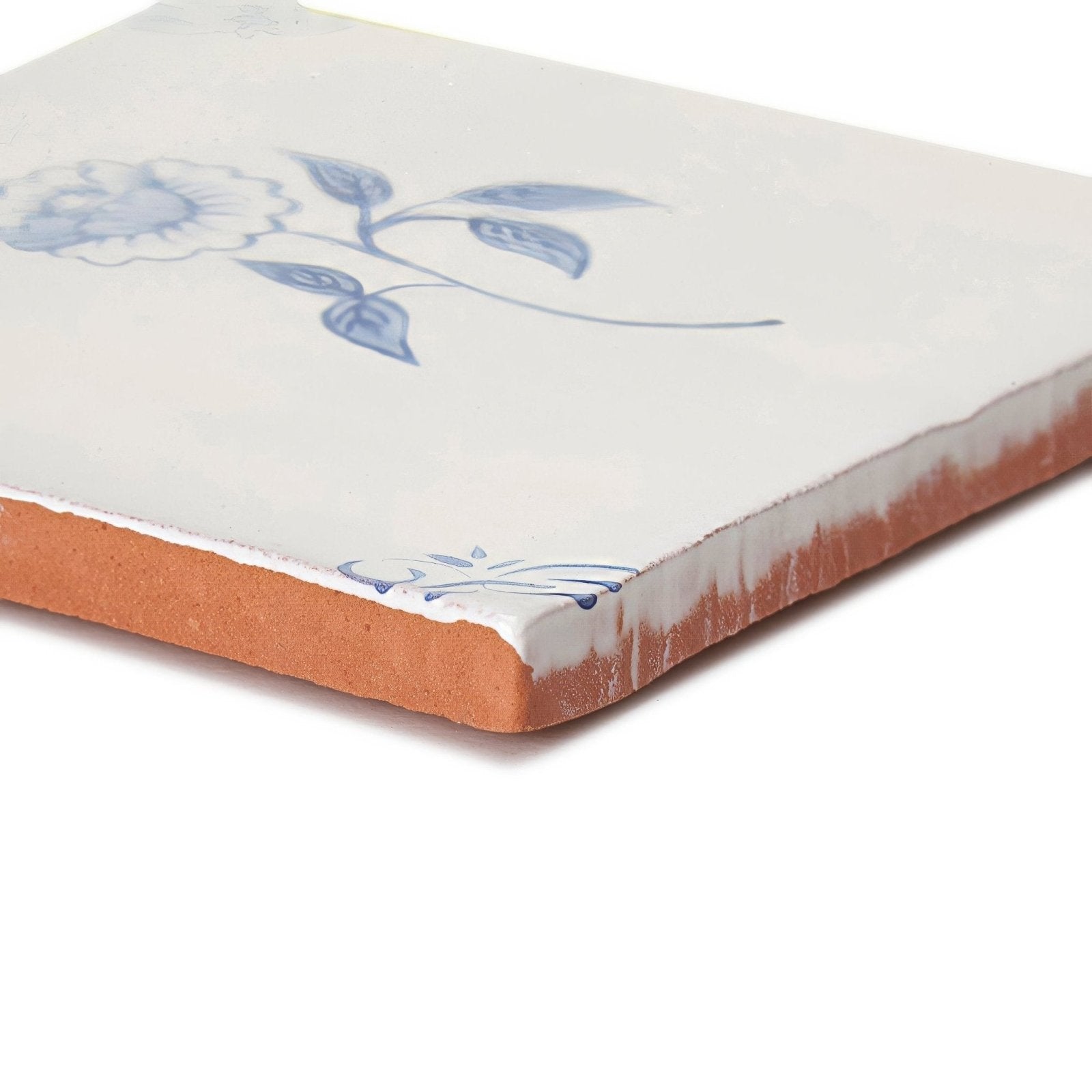 English delft peony blue gloss tile white ceramic with delicate blue floral design and exposed terracotta edges