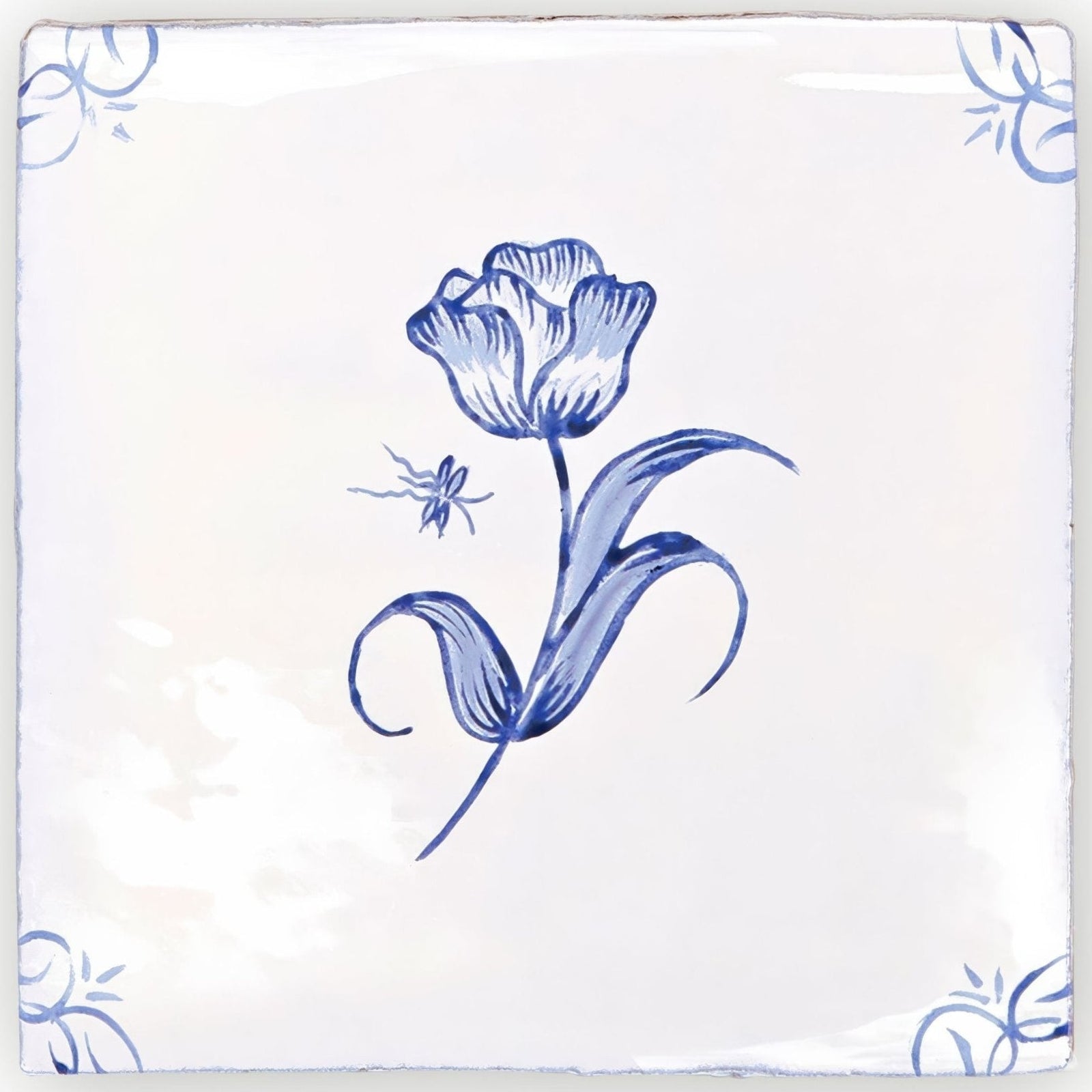 A square white ceramic tile with a blue hand painted tulip and floral design english delft tulip blue gloss tile