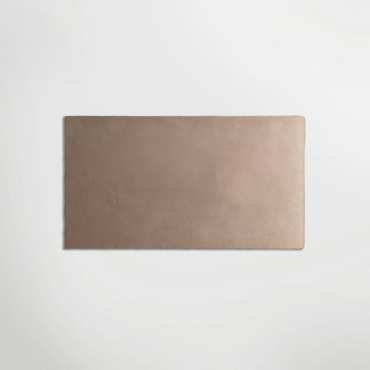 A rectangular taupe-colored matte tile with a slightly textured surface from english heritage blackfriars cream rectangle