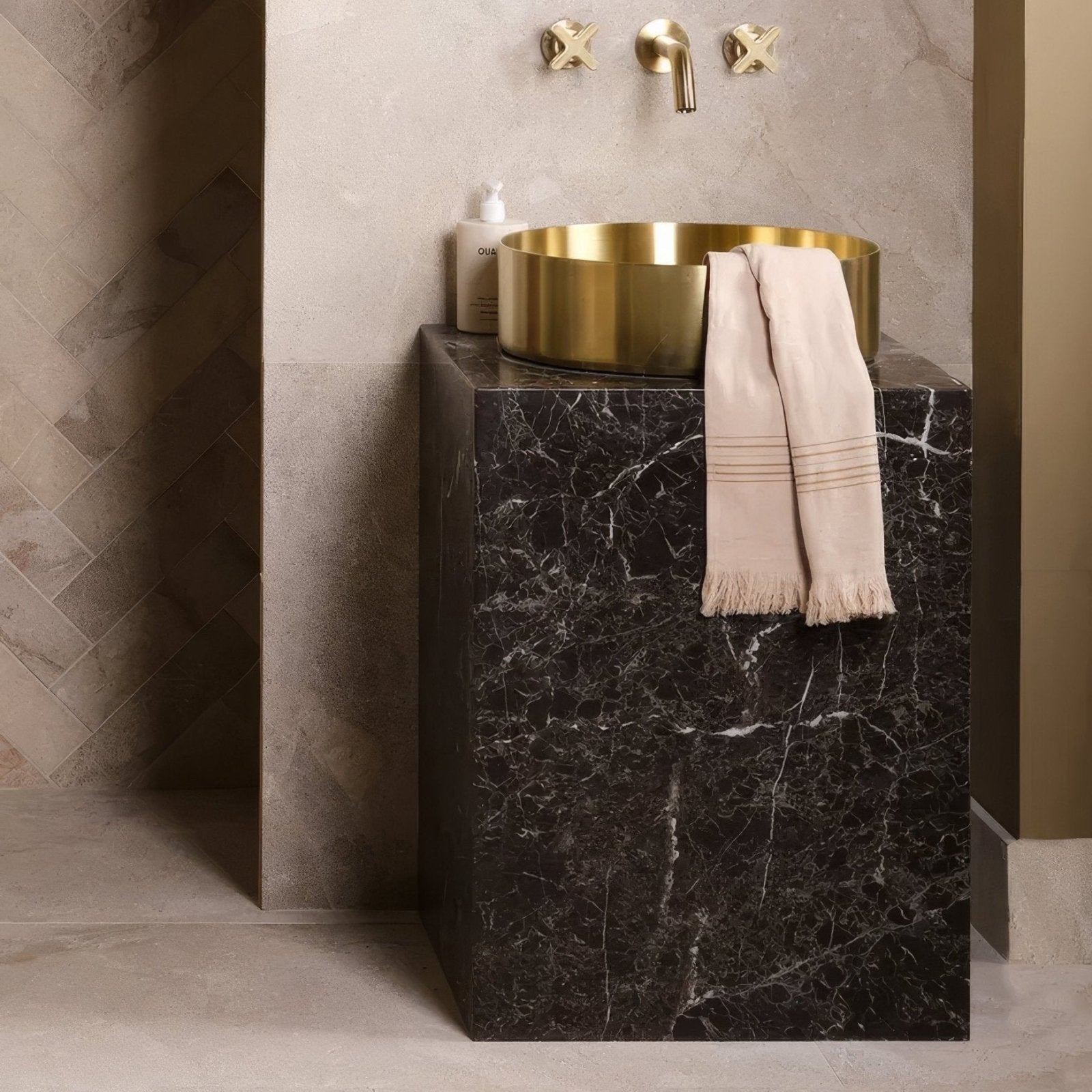 Brass vessel sink with sleek cylindrical design and polished finish in enki limestone velvet finish product