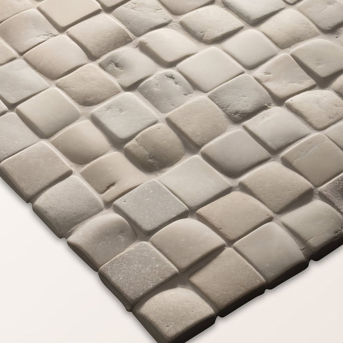 Gray stone mosaic tile with textured interlocking square pattern from enso cobble mosaic cube sand collection