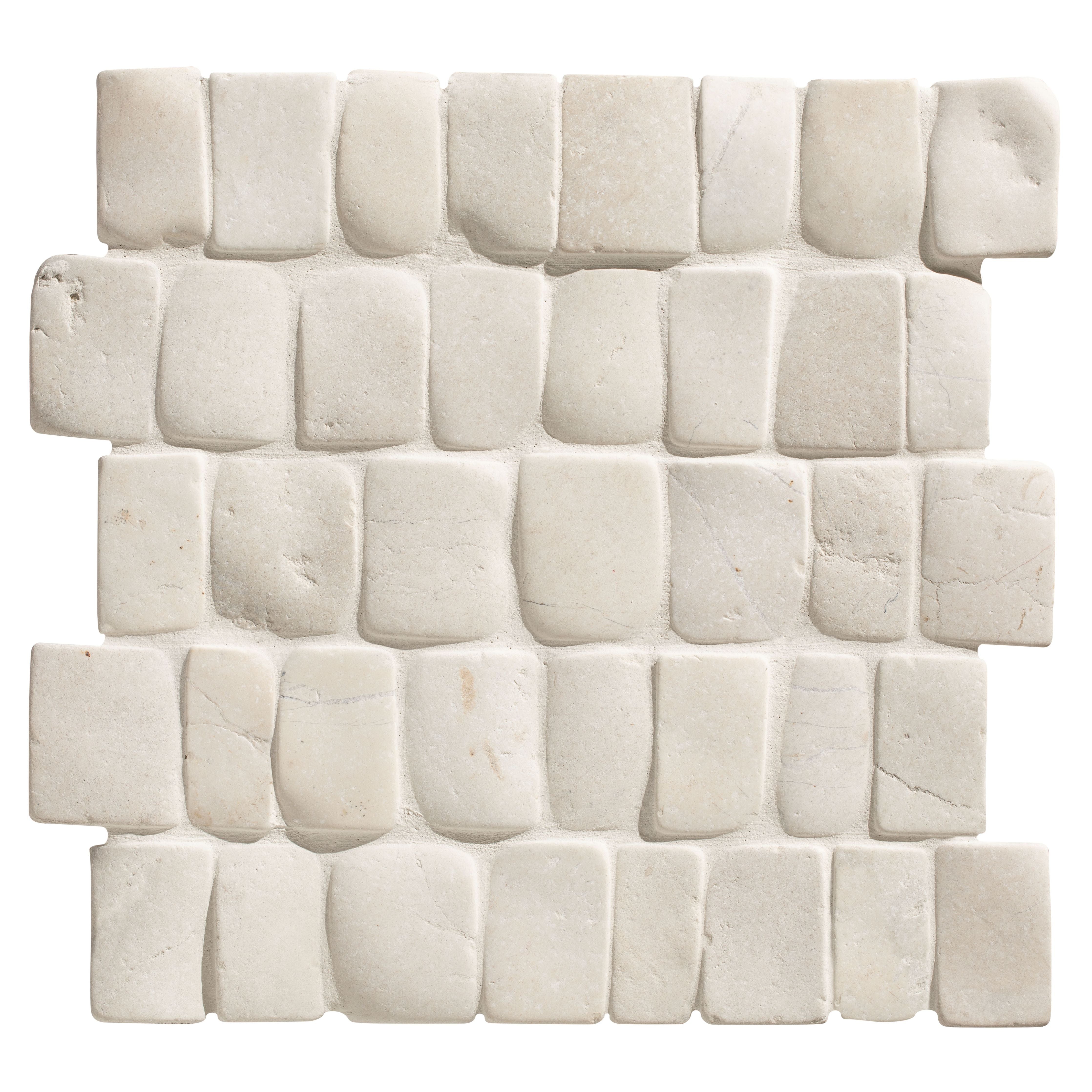 Enso cobble mosaic strip chalk white textured stone tile with irregular rectangular pieces in staggered pattern