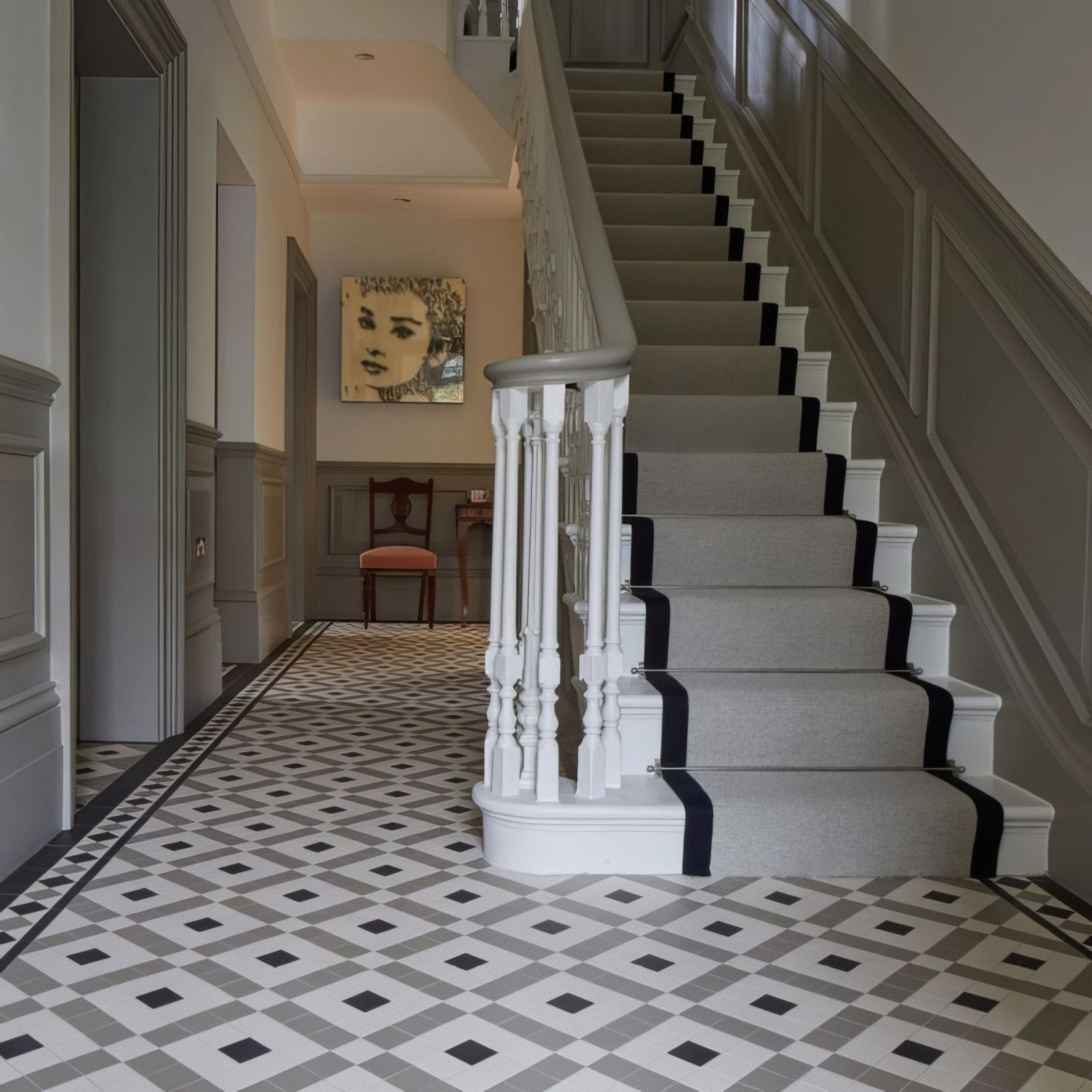Exeter chester mews and dover white gray carpeted staircase with black striped runners and white balusters