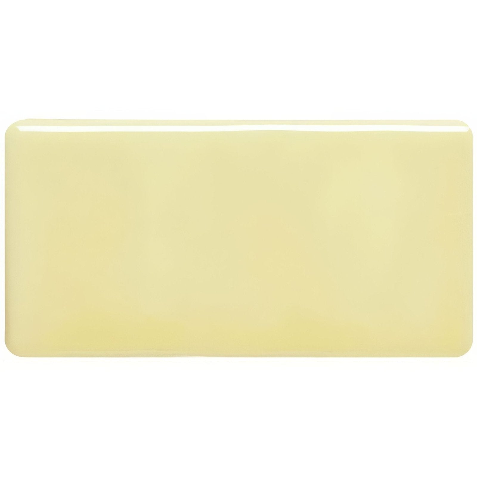 A smooth rectangular beige ceramic flax half tile with rounded edges and a glossy finish
