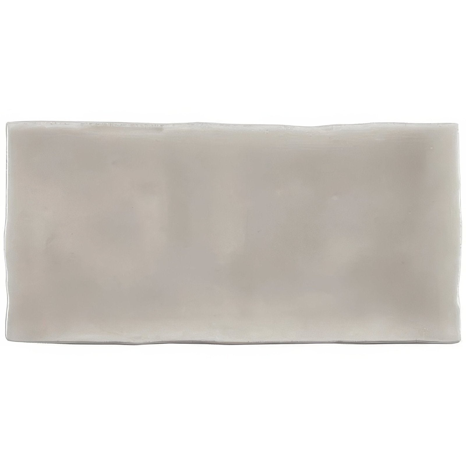 A sleek rectangular flint half tile wall tile with a smooth matte finish in subtle grayish white ceramic