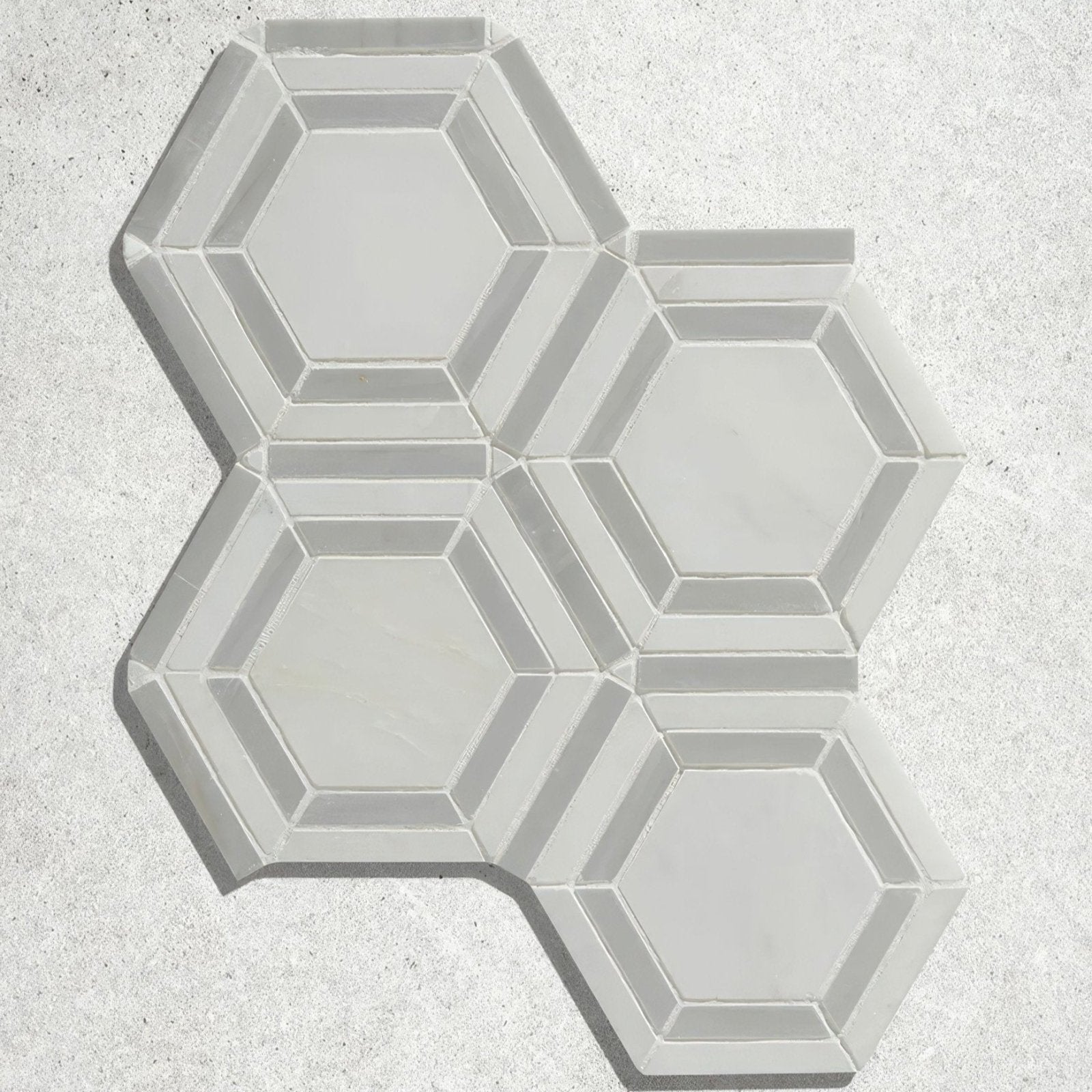 Florence marble mosaic gray hexagonal tile with raised beveled edges and smooth glossy finish for wall or floor use