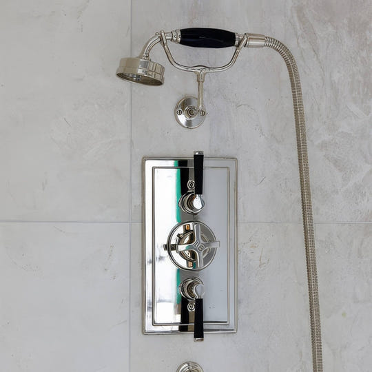 Folio Marble Honed Finish 61 x 40.6cm off-white marble tiles with a chrome shower system
