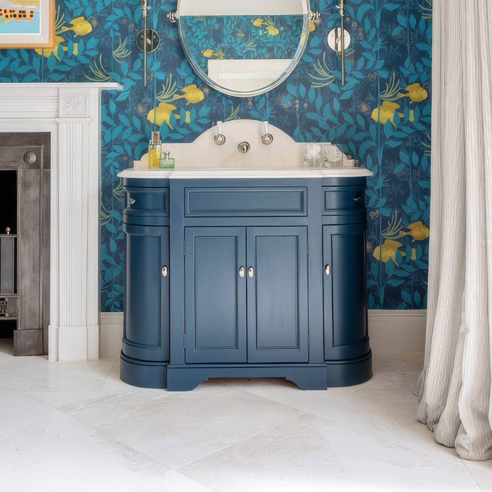 Deep blue painted bathroom vanity with white ceramic sink and silver fixtures complementing folio marble honed 61 x 61cm tiles