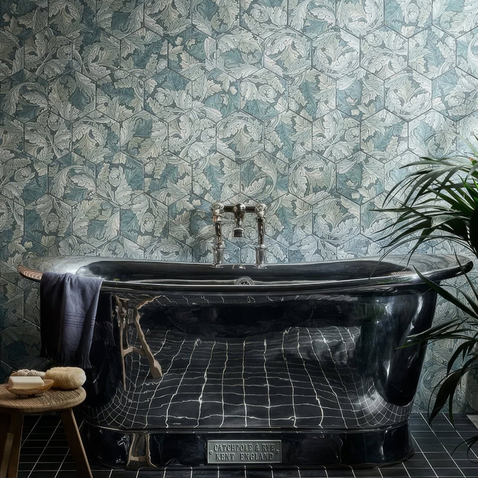 Black marble bathtub with chrome fixtures and vintage catchpole and rys kent england plaque folly porcelain moss matt finish