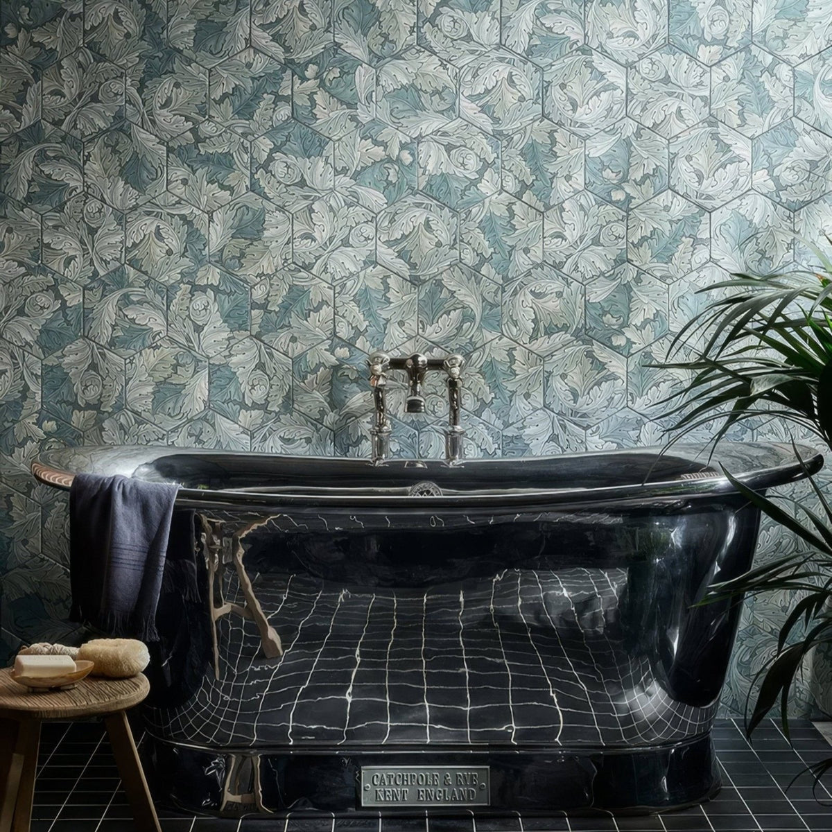 Black marble bathtub with chrome fixtures and vintage catchpole and rys kent england plaque folly porcelain moss matt finish