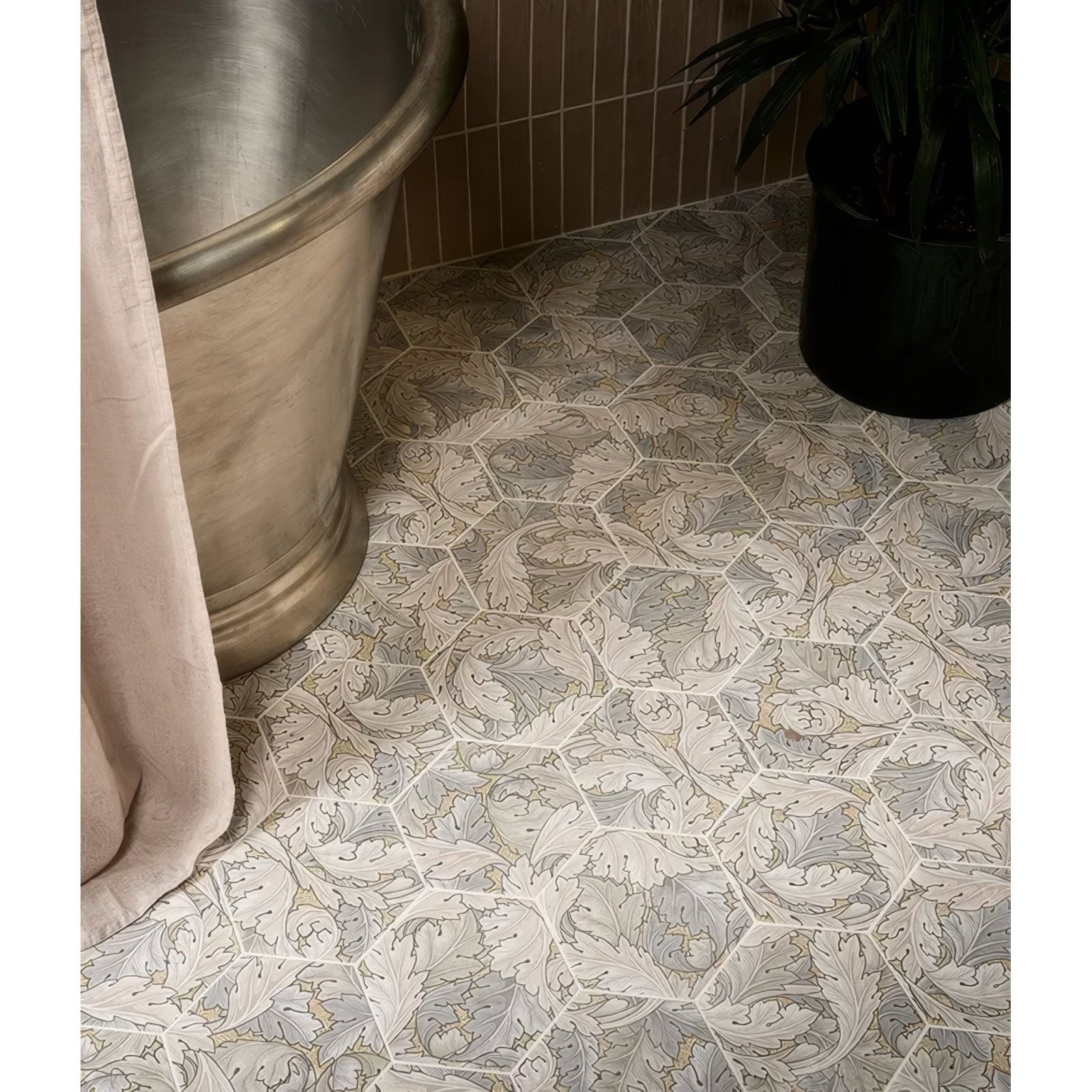 Hexagonal porcelain floor tiles with intricate vintage leaf pattern in shades of gray and off-white folly sand matt finish