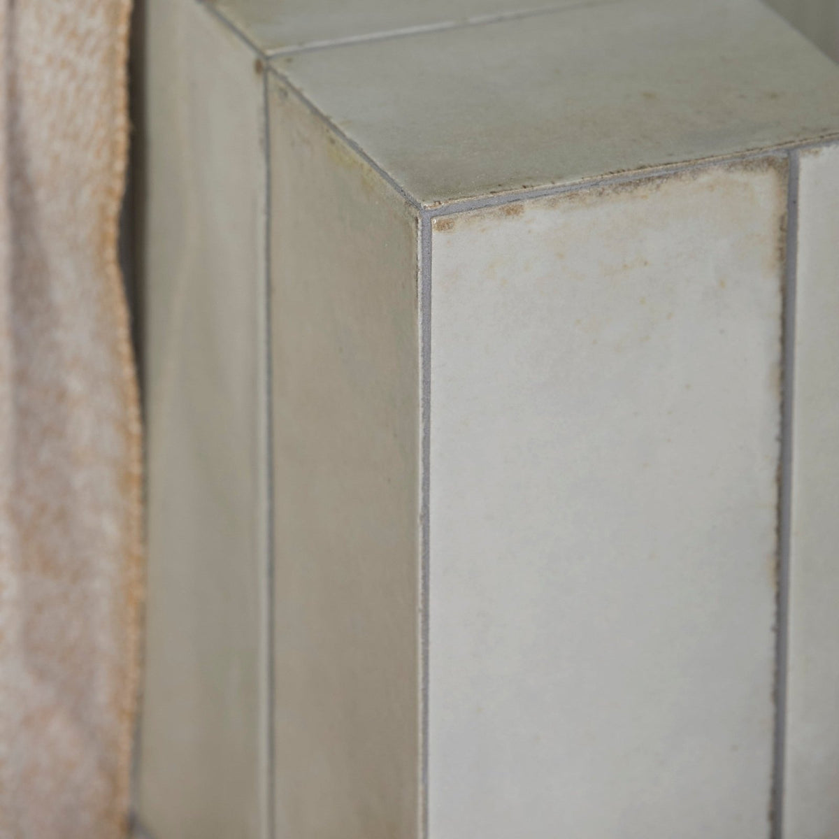 Fontenay porcelain metro wall tile featuring a rectangular off-white ceramic design with textured surface and grout lines