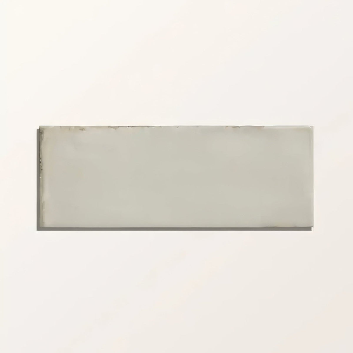 A sleek rectangular ceramic fontenay porcelain metro wall tile with a smooth matte gray finish and subtle edges