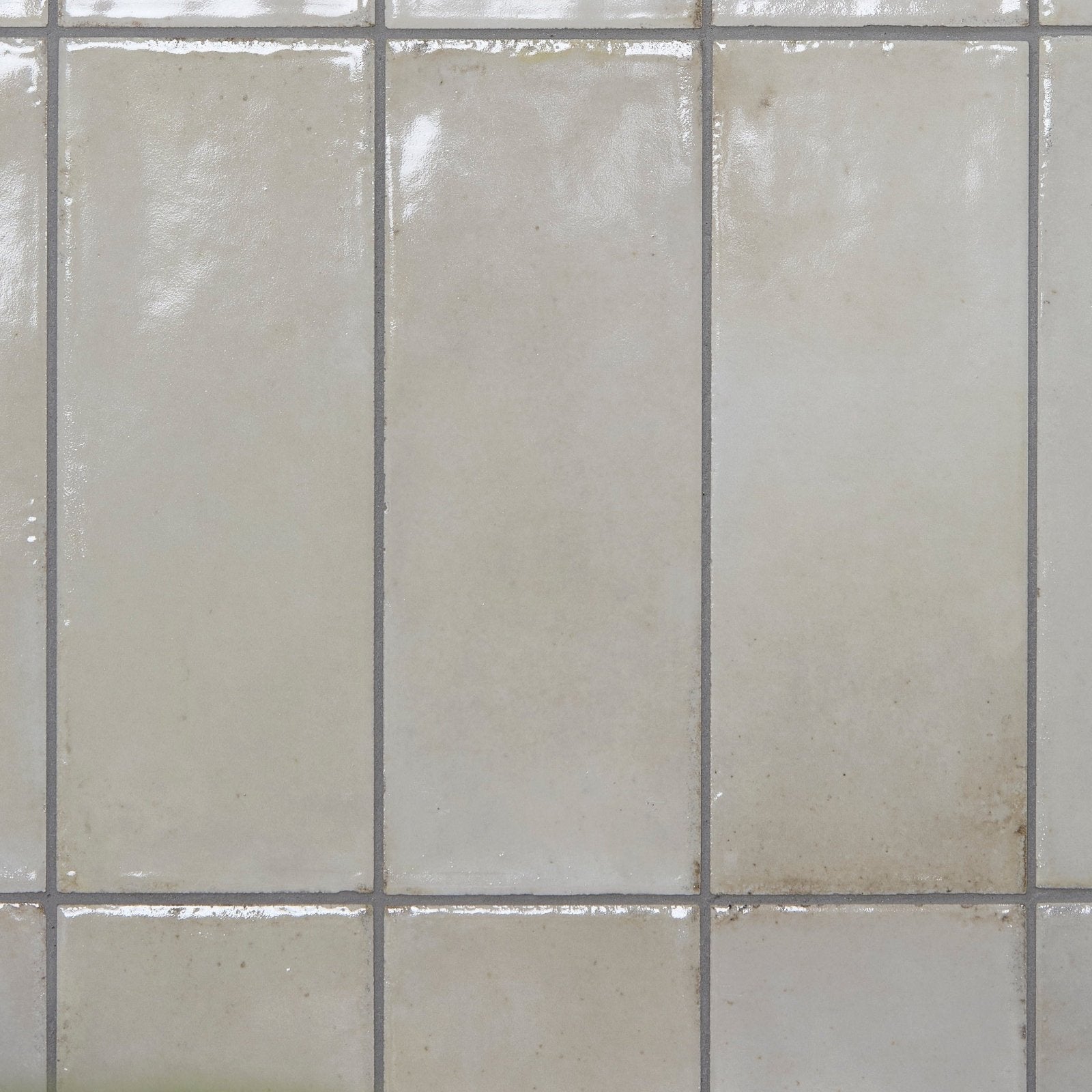 Off-white glossy fontenay porcelain metro wall tiles with faint grout lines ideal for stylish wall applications